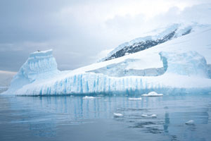 Vertical melt lines may form while the iceberg is underwater as bubbles are released while the ice melts.