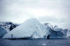 The pockets on this iceberg were formed when this side of the berg was underwater.
